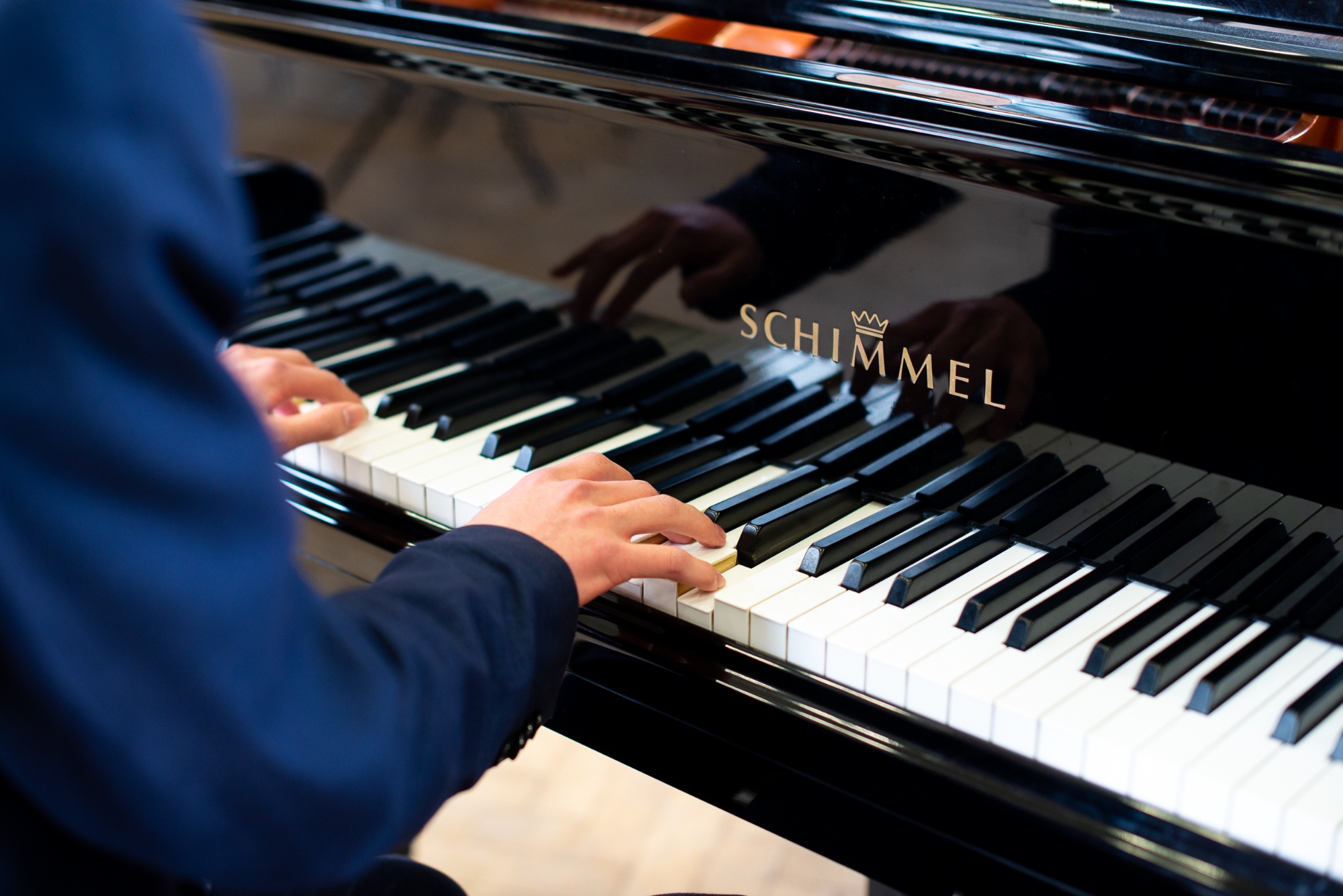 Pupil playing the piano