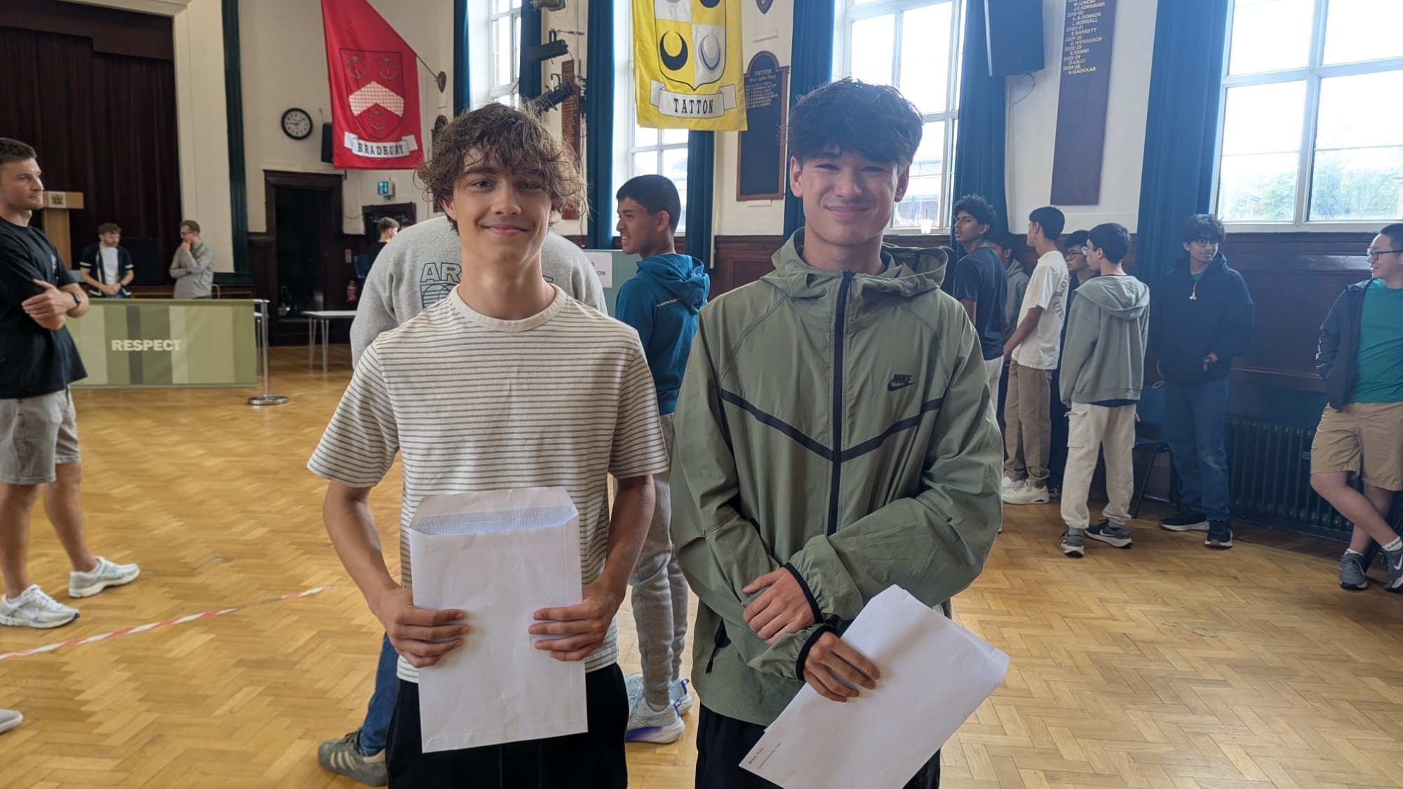 boys receiving gcse results in the hall