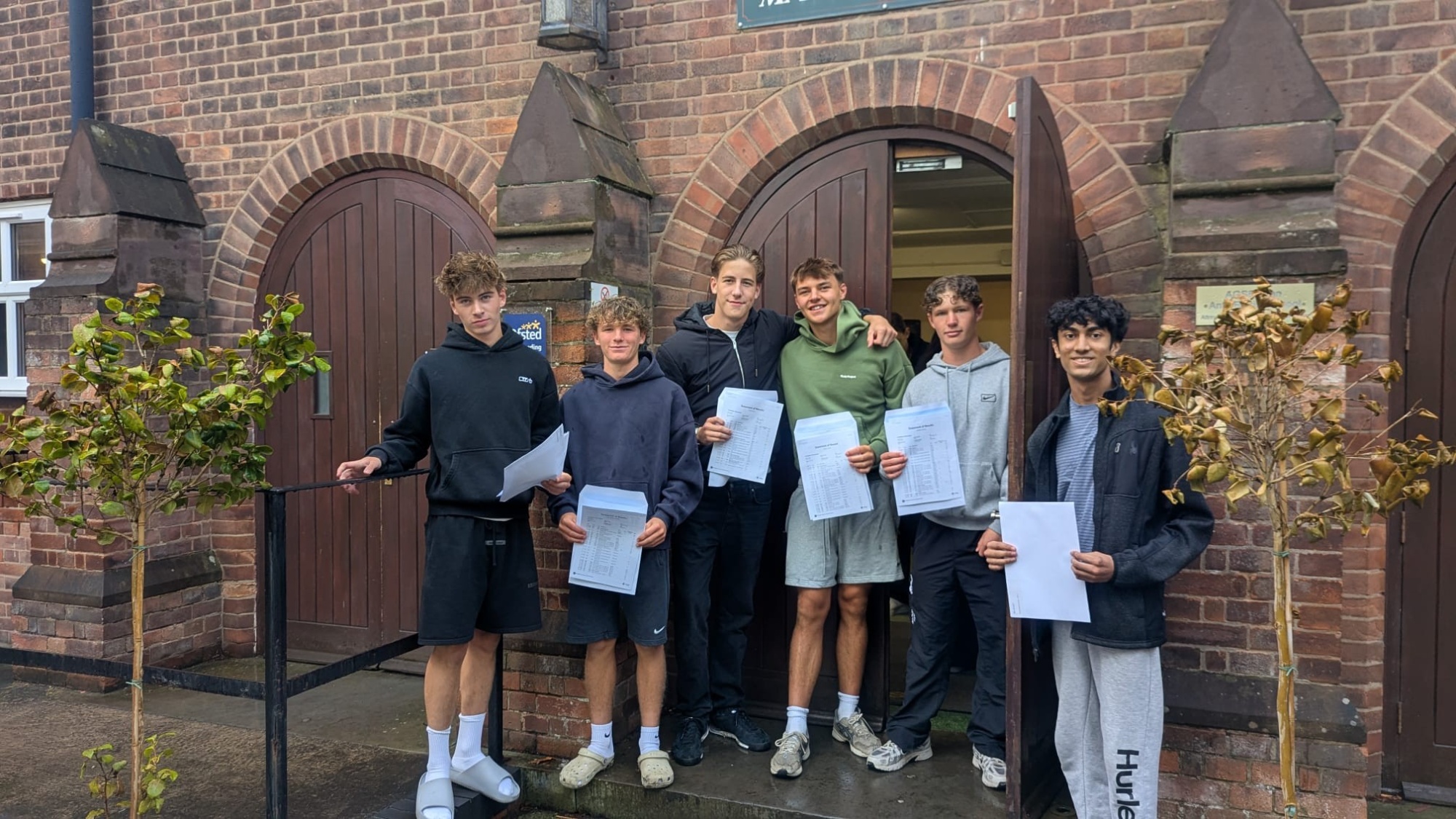 Students with their GCSE results